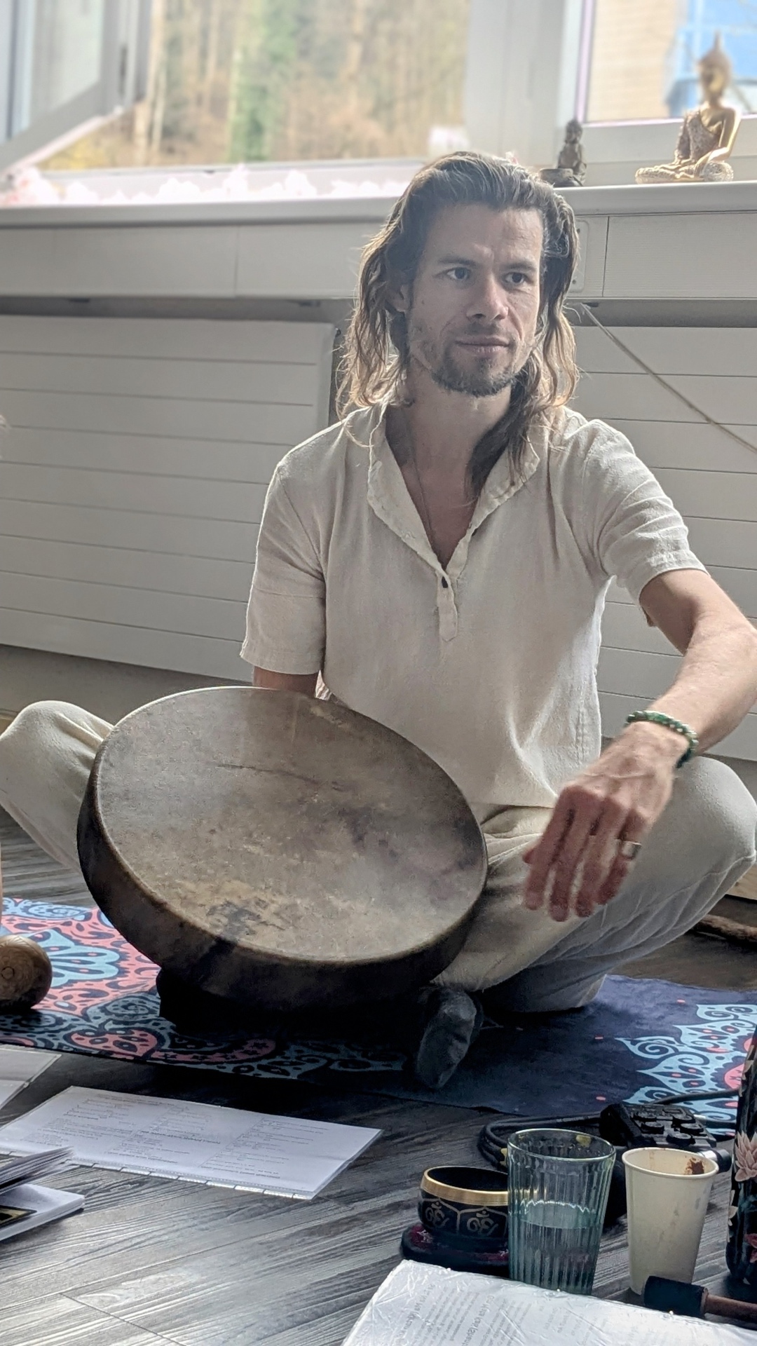 András Kapros with a shamanic frame drum during a ceremony in Zurich